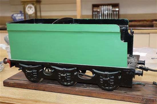 A 3.5 inch gauge 4-4-2 live steam locomotive and tender on wood stand, loco 27in. tender 18in.